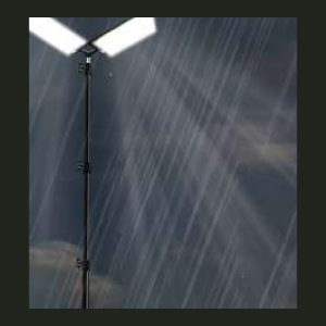 Lumeno Camp and Braai Light, a twin-panel LED area light on a telescopic tripod lighting a campsite at night